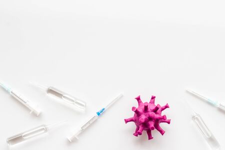 Corona virus Covid-19 - vaccine concept with syringe - on white background top-down frame copy spaceの写真素材