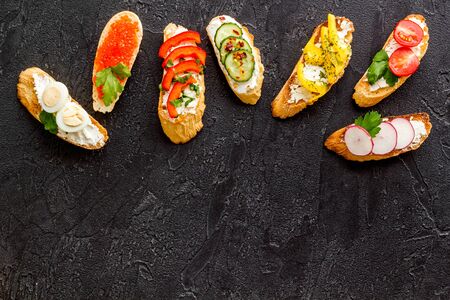 Sandwiches frame for menu design on black background top-down.の写真素材