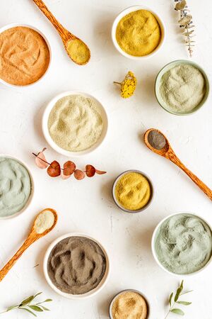 Blue, yellow, white. red, black cosmetic clay background on white table top-down patternの写真素材