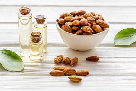 Healthy nutrition. Almond oil in small bottles on white background.の写真素材