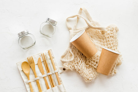 Set of reusable items for eco-friendly lifestyle. Cotton bag, glass jars, wooden tableware. Zero...