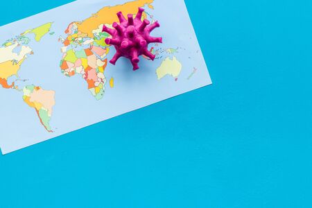 Corona virus Covid-19 - epidemic concept with world map - on blue background top-down copy spaceの写真素材