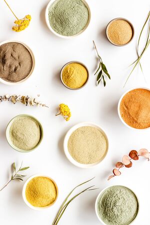 Blue, yellow, white. red, black cosmetic clay background on white table top-downの写真素材