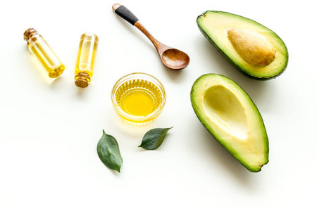 Avocado oil - ingredient for cosmetics - on white background.