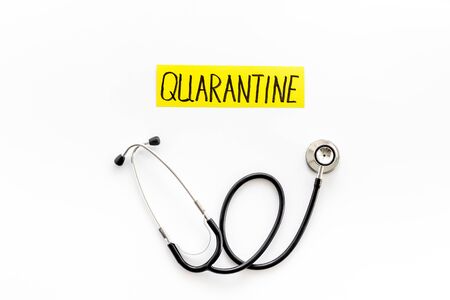 Quarantine sick at home. Stethoscope on white background top-downの写真素材