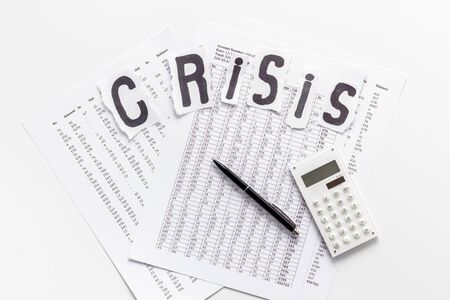 Financial crisis concept with calculator on white background top viewの写真素材