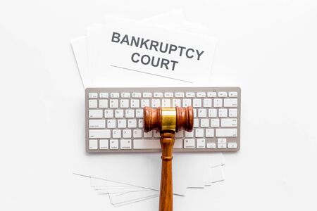 Bankruptcy court concept with gavel, document, keyboard on white background top-down.の写真素材
