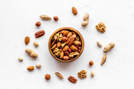 Mixed nuts in bowl on white background top-downの写真素材