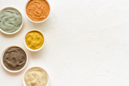 cosmetic clay - Yellow, red, white, blue and black dry powder - top-down flat lay space for textの写真素材