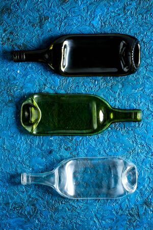 Pattern of bottles on blue table top-downの写真素材