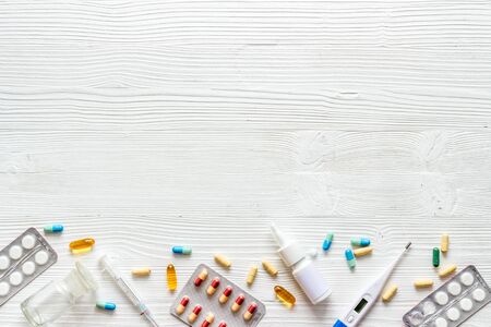 Pharmacy - pills, tablets - flu, cold health care. on white wooden background from above copy space