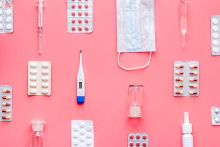 Cold, flu and virus treatment - flat lay with medicine - on pink background top viewの写真素材