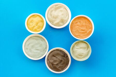 cosmetic clay - Yellow, red, white, blue and black dry powder - top-down flat layの写真素材