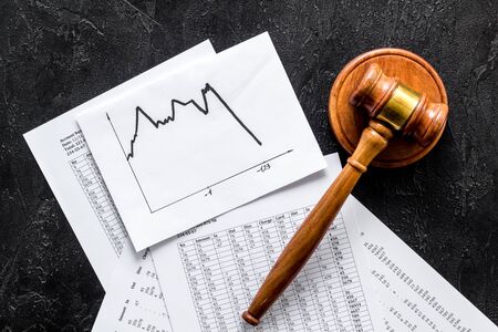 Debts - judge gavel, crisis graph - on black desk top-downの写真素材