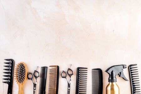 Hairdresser tools. Flat lay on beige background top view copy spaceの写真素材