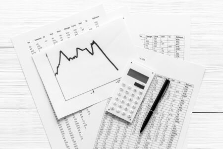 Financail crisis - business grahp, markets crash - on white wooden background top-down.の写真素材