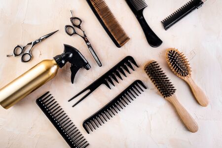 Hairdresser tools. Flat lay on beige background top viewの写真素材