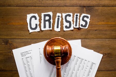 Financial crisis concept with gavel - debt, bankruptcy - on wooden background top viewの写真素材