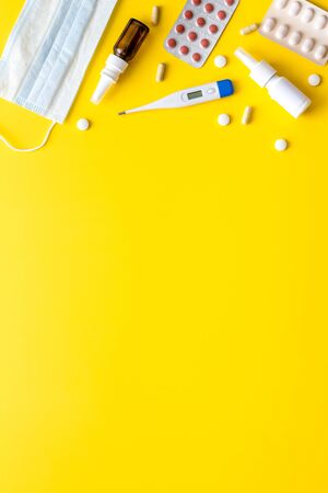 Pharmacy - pills, tablets - flu, cold health care. on yellow background from above copy spaceの写真素材