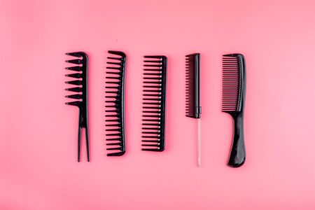 Hairdresser tools. Flat lay on pink background top view.の写真素材