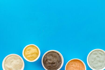 Yellow, red, white, blue and black cosmetic clay top view copy spaceの写真素材