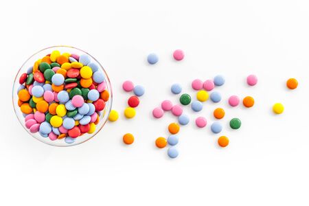 Colorful sweets on white desk from aboveの写真素材
