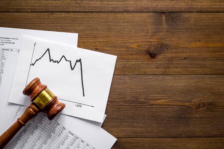 Debts - judge gavel, crisis graph - on wooden desk top-down copy spaceの写真素材