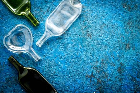 Flat lay with bottles on blue table top-down copy spaceの写真素材