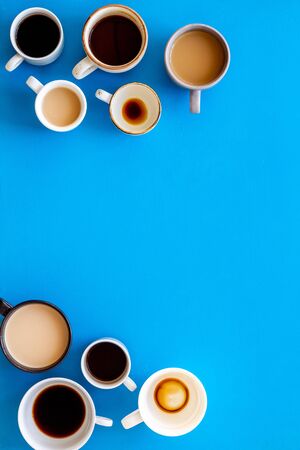 Flay lay with cups - coffee break - on blue background top view.の写真素材
