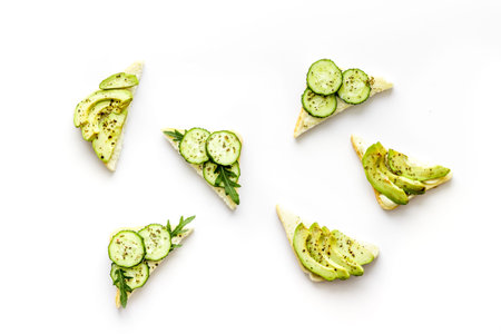vegan avocado sandwiches on white background top view pattern