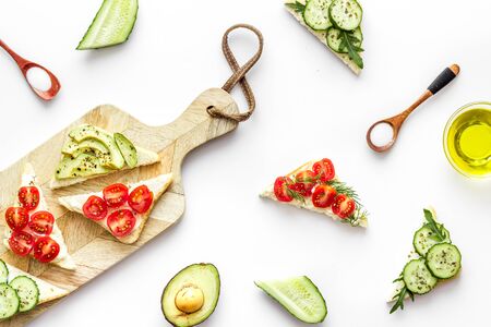 vegan avocado sandwiches on white background top view patternの写真素材