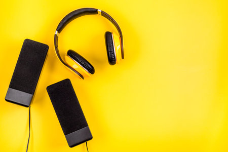 listen to music concept. audio speakers and headphones on desk copy spaceの写真素材