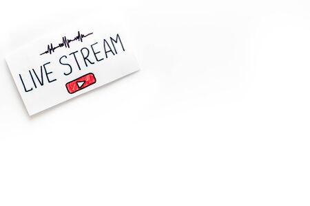 Live streaming concept - words on paper tablet on white top view.の写真素材