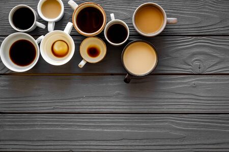 Flay lay with cups - coffee break - on wooden background top view copy spaceの写真素材
