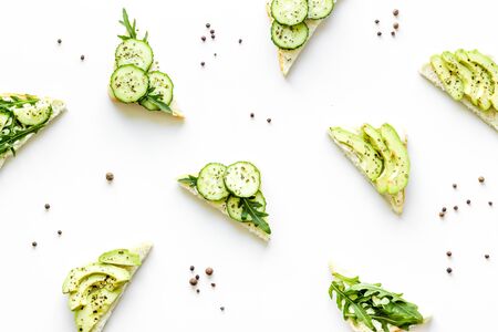 pattern green sandwiches with avocado on white desk top viewの写真素材