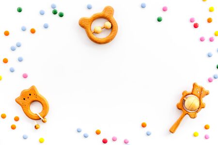 Baby accessories and toys on white table top-down copy spaceの写真素材
