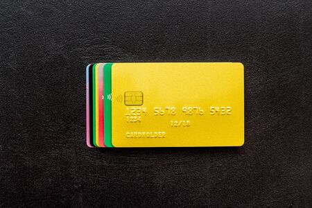 security concept. stack of credit card on black desk top-downの写真素材