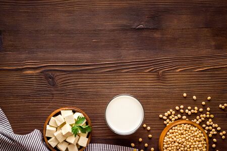 vegan soy milk with soy beans on wooden background top-down copy spaceの写真素材