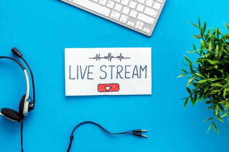 Online streaming social media concept. Paper tablet on office desk top viewの写真素材
