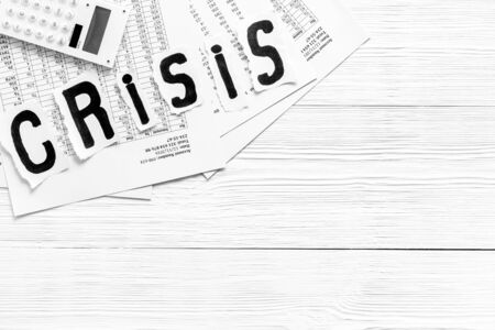 World financial crisis concept - documents, calculator - on white wooden background top view copy spaceの写真素材