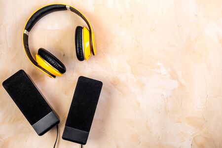 listen to music concept. audio speakers and headphones on desk copy spaceの写真素材