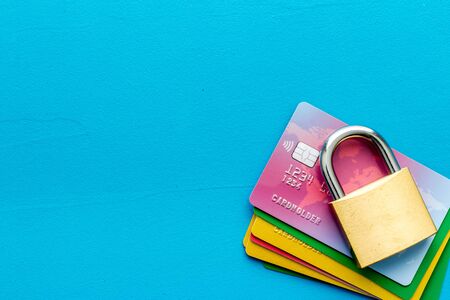 credit card with security lock on blue desk top view copy spaceの写真素材