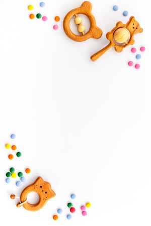 kids desk with toys and candy from above space for textの写真素材