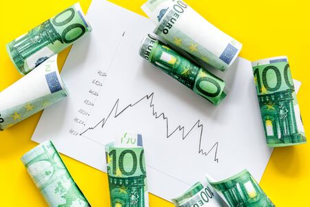 Stock market chart with euro banknote top viewの写真素材