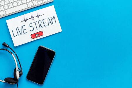Online streaming social media concept. Paper tablet on office desk top viewの写真素材