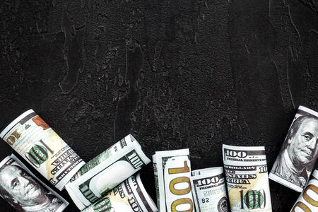 A lot of US dollars banknote on blackの写真素材