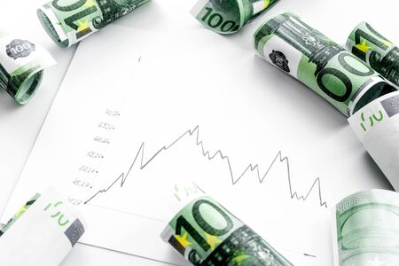 Stock market chart with euro banknote top viewの写真素材
