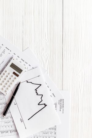 Financail crisis - business grahp, markets crash - on white wooden background top-down copy spaceの写真素材