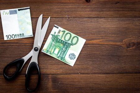 Decline of euro exchange rate. Scissors cut dollars banknoteの写真素材