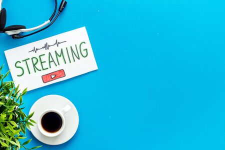 Online streaming social media concept. Paper tablet on office desk top view.の写真素材